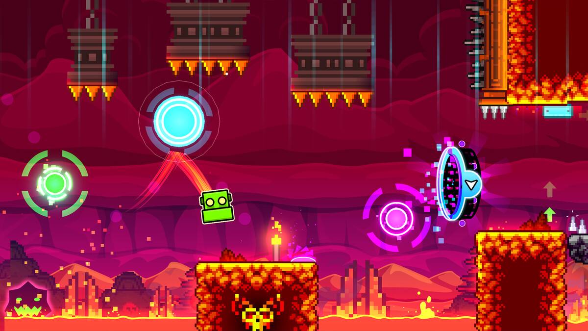 Geometry Dash: a cube jumps between glowing rings over lava-coloured blocks